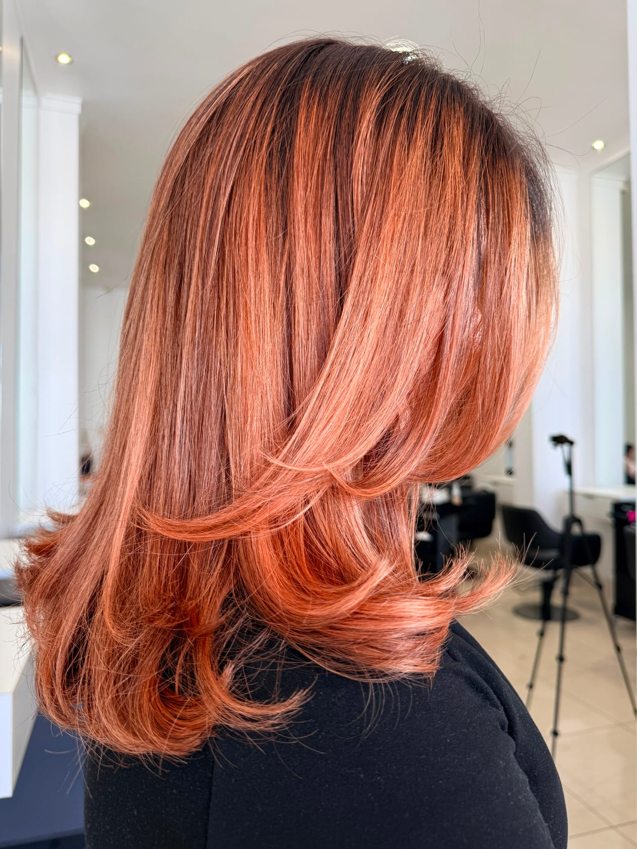 Copper balayage finished with a layered blow-wave by UNIK Hair Design