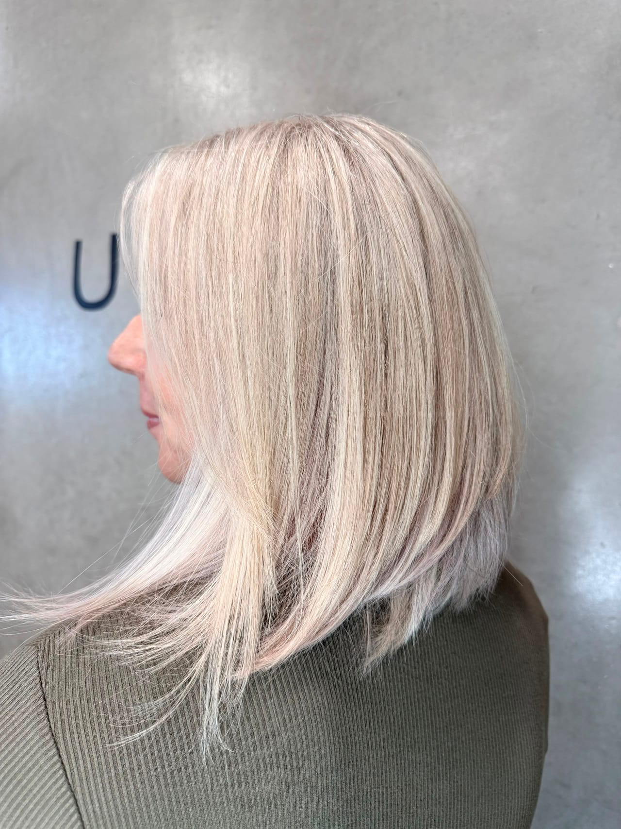 Icy platinum blonde lob by UNIK Hair Design