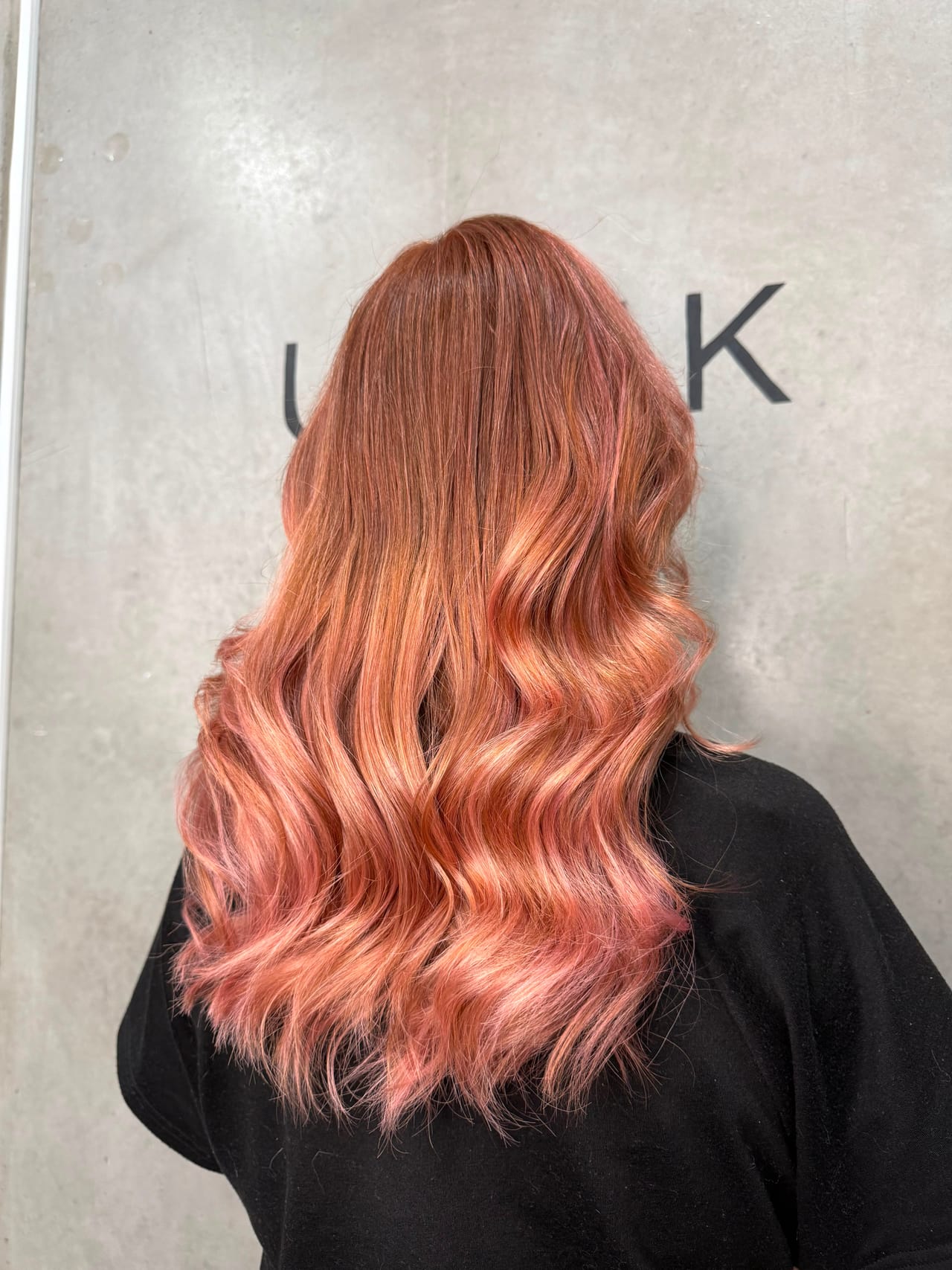 Rose gold balayage with soft waves by UNIK Hair Design